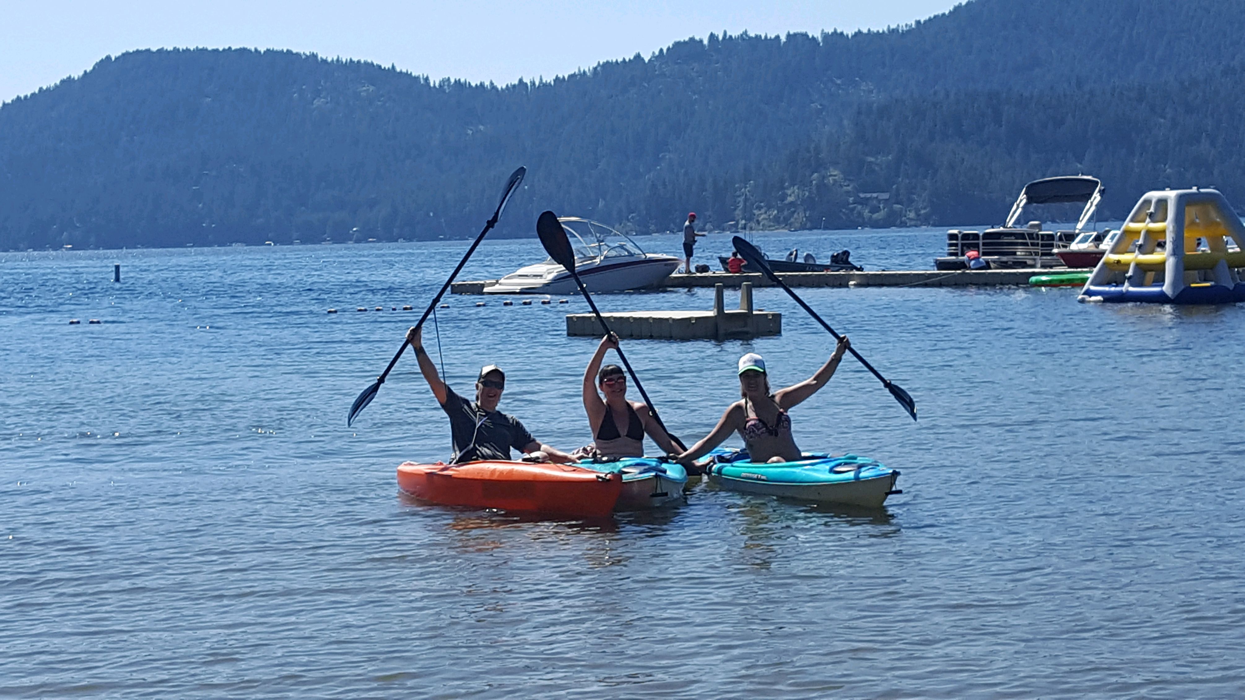 Designer Decal employees in kayaks